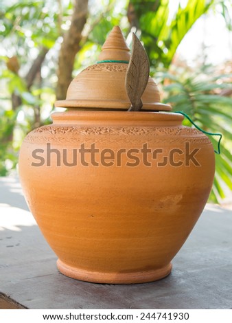 The ancient stone jar with flower patterns in Thailand