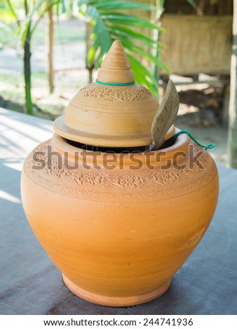 The ancient stone jar with flower patterns in Thailand