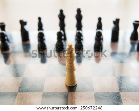 The white chess standing in front of black chess means Courage, Shallow in depth of field