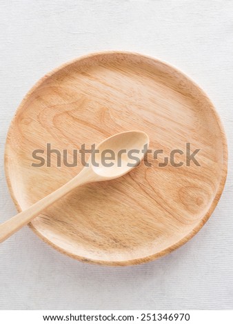 wood dish and spoon on cloth table