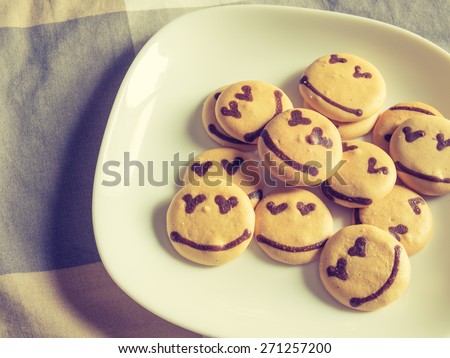 Homemade smile cookie on the bed, Good morning concept, Vintage filter process