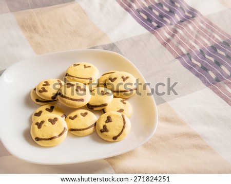Homemade smile cookie on the bed, Good morning concept, Vintage filtered