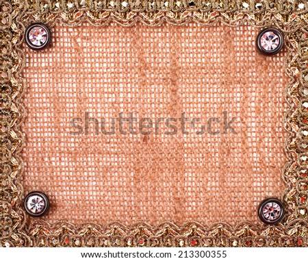 Lace frame on a sacking background