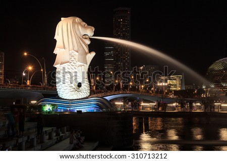 Singapore, Singapore - May 18, 2015: The Merlion statue in Singapore at night. The Merlion is a traditional creature in Singapore with a lions head and a body of fish.