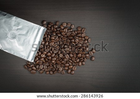Top view coffee beans in aluminum foil bag package