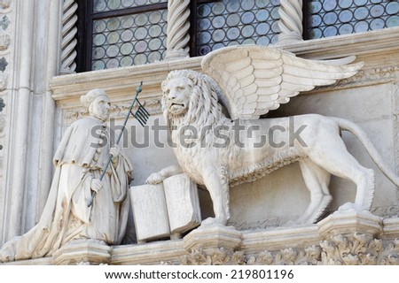 Winged lion, symbol of the city, with the Doge, on the Doge\'s Palace, San Marco, Venice.