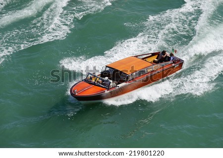Water taxi, speeding across open water towards San Marco. This is the quickest form of transport in Venice.