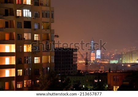 Night view of the city and residential building in foreground