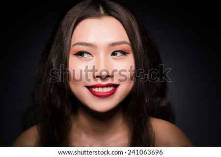 Funny Sexy bright makeup woman with long lashes. Closeup portrait. Beautiful asian young model with Brown eyes - Red Lipstick, Smoky Eyes