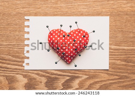 heart and needles with note on wooden background. Vintage style. Valentines day concept