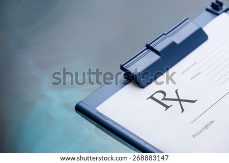 Empty medical prescription on blue reflective background
