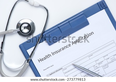 Health insurance application form with pen and stethoscope concept for life planning.