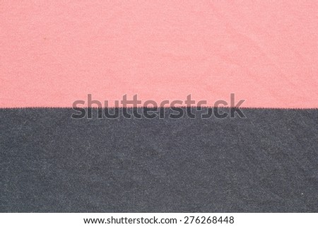 Pink and black synthetic fabric background