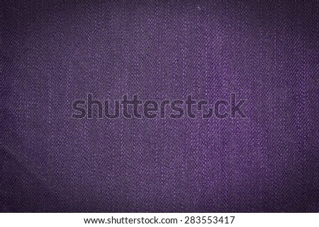 Abstract violet background from synthetic fabric in black shadow