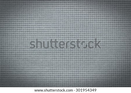 Abstract dark color background from synthetic fabric in black shadow