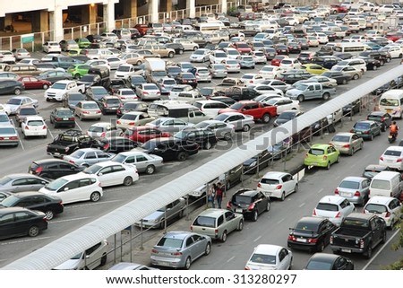 BANGKOK THAILAND - JUN 13 : Many cars in parking lot on Jun 13, 2015 at Mo Chit Skytrain station in Bangkok, Thailand