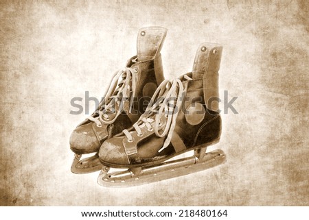 pair of old ice skates, textured background, black and white version, retro, vintage