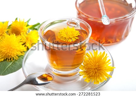 dandelion herbal tea on white background, isolated, with yellow blossom in teacup, leaf and honey,
