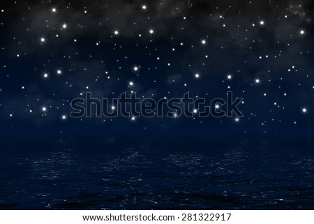 dark blue night sky over ocean with nebula, clouds and shiny stars, background