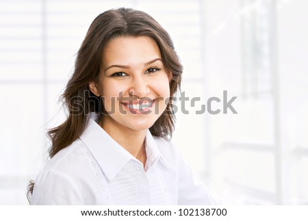 Portrait of pretty young business woman smiling