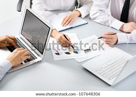 Group Of Business People Busy Discussing Financial Matter During Meeting