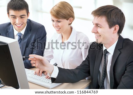 Portrait of a group of business people working together at a meeting