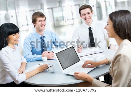Image of young business people working at meeting