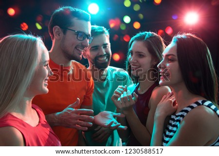 Group of happy young people having fun at party.
