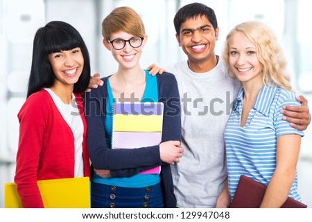Group of happy students on a white background