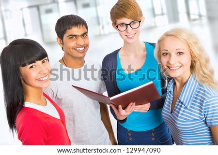 Group of happy students on a white background