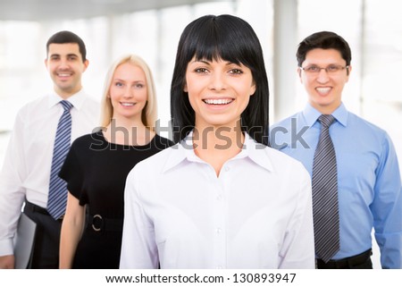 Group of business people with businesswoman leader on foreground
