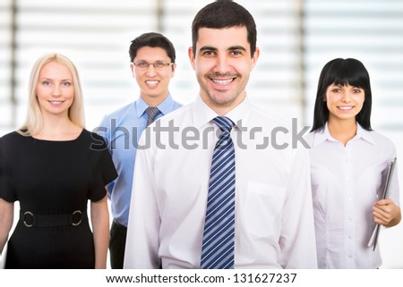 Group of business people with businessman leader on foreground