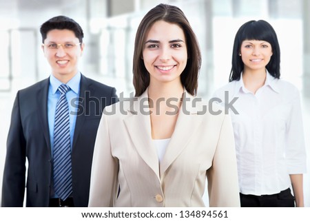 Group of business people with businesswoman leader on foreground