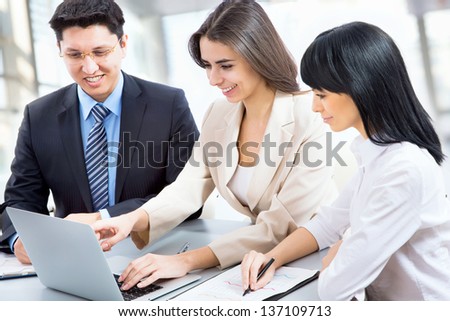 Group of business people working together in an office