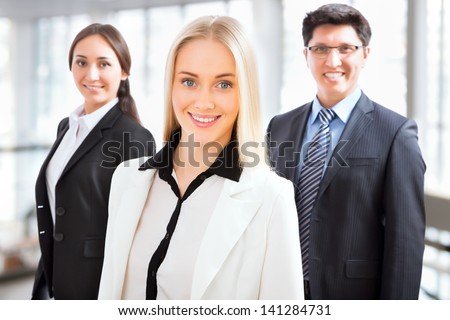 Group of business people with business woman leader on foreground