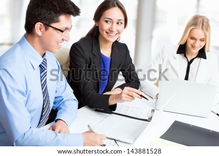 Group of business people working together in an office