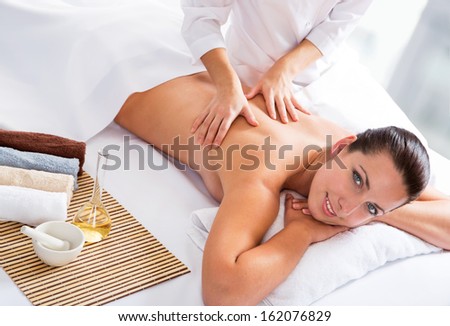 Young beautiful woman relaxed in spa environment