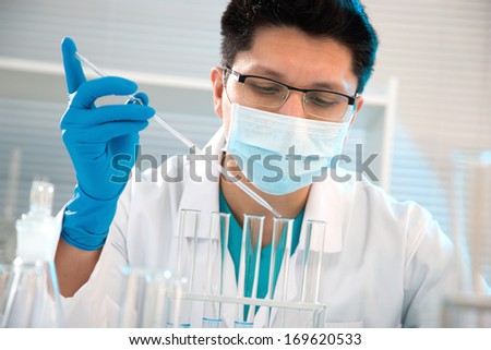 Young medical scientist working in laboratory