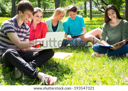 Group of students studying together in campus ground