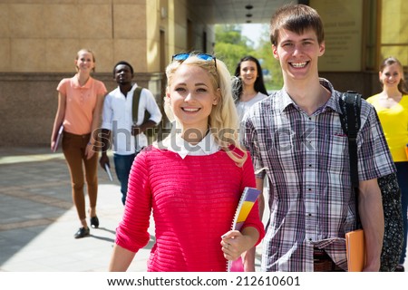 Group of diverse students outside walking together