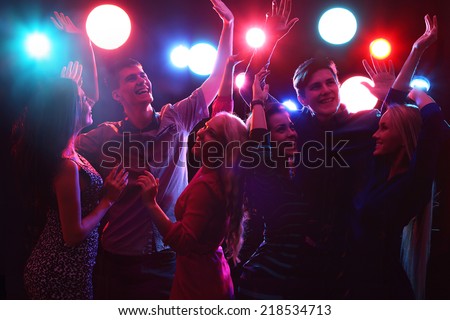 Young people having fun dancing at party.