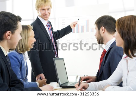 Image of business people listening their boss at seminar