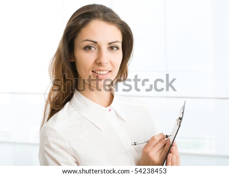 A portrait of a young business woman with a map case