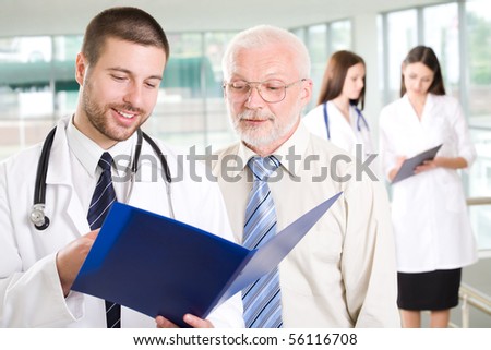 The young doctor talks to the patient