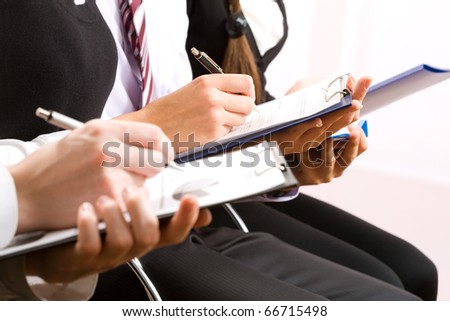 Close-up of business person hand working with document
