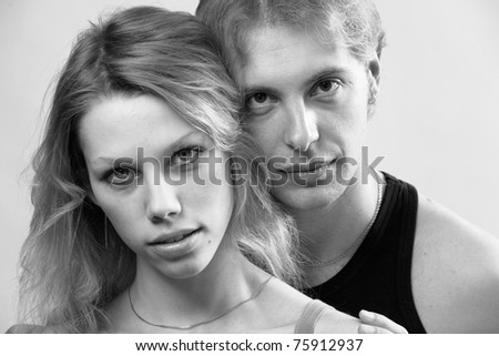 Closeup portrait of a syoung couple together. Black and white