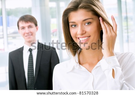 Young business woman with of her co-worker at modern office