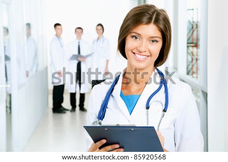 A young female doctor looking at camera