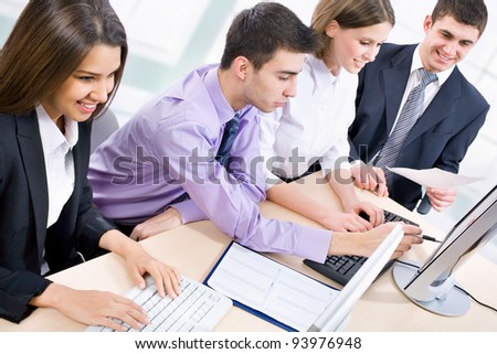 Group of happy business people in a meeting at office