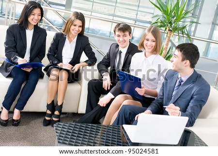 Image of young business people working at meeting